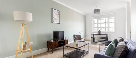 Apartment | Living area | 32-inch flat-screen TV with cable channels, Netflix, streaming services