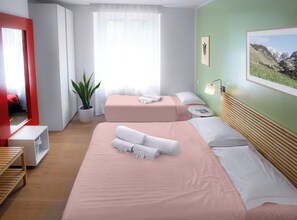 A hotel room with a large bed, a small sofa, a potted plant, a window with sheer curtains, and a framed picture on the wall. - Il Giardino di Gioia (Verona)