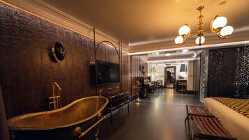 Suite Deluxe, balcón, vistas al jardín | Zona de estar