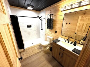 Shower, towels, soap, toilet paper