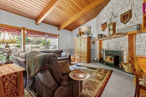 Smart TV, fireplace, books, printers