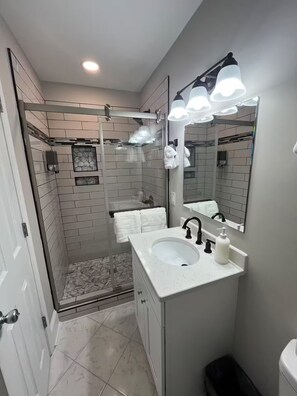 Shower, hair dryer, towels, soap