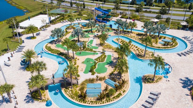 An aerial view of a resort with a large pool, multiple water slides, and a basketball court. - Storey Lake 4 BR With Private Pool (Kissimmee)