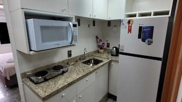 Apartment, 1 Queen Bed, Kitchenette | Private kitchen | Full-size fridge, microwave, stovetop, cookware/dishes/utensils