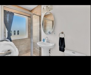 Shower, towels, soap, toilet paper