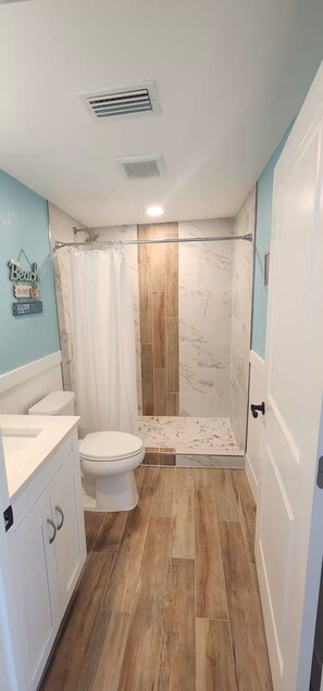 Shower, hair dryer, towels, soap