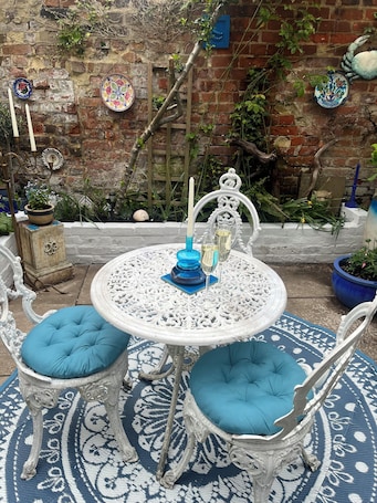 Outdoor dining. Beautiful Medieval Town House with original beams, log fires & quirky interiors