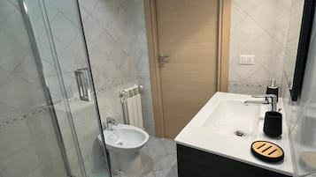 Hair dryer, towels, soap, toilet paper