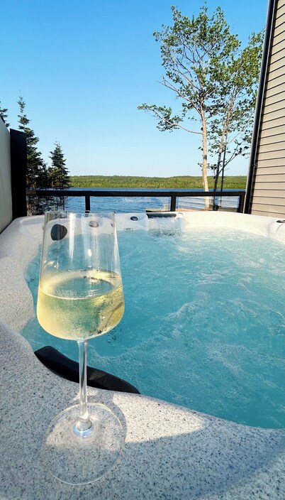 The Luxurious Lakefront Reset on Porters Lake with private beach and hot tub!