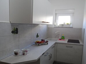 Fridge, coffee/tea maker, cookware/dishes/utensils