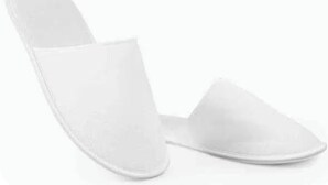 A pair of white slip-on shoes. - Vatican Pixel Apartments - DOUBLE (Unknown)