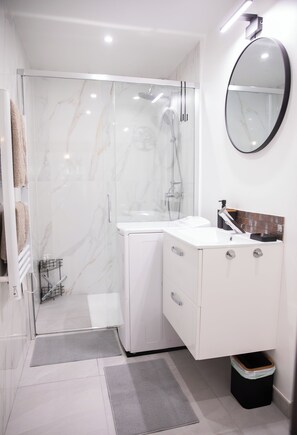 Shower, hair dryer, towels, soap