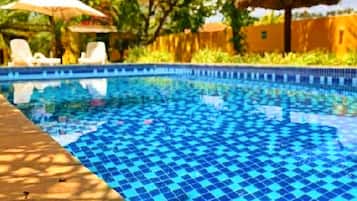 Outdoor pool, open 8:00 AM to 8:00 PM, free cabanas, pool umbrellas