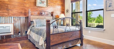 Un dormitorio con una cama de madera, una ventana y un radiador.
