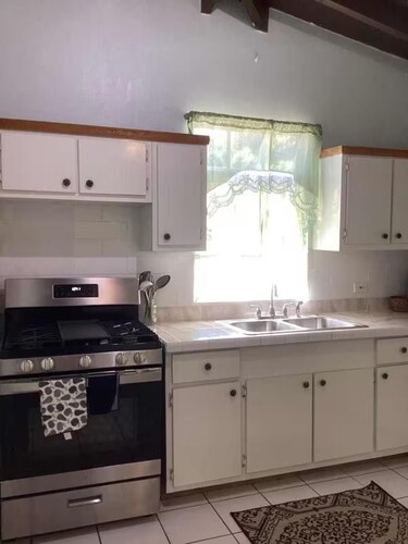 Experience a spacious three-bedroom, two-bathroom villa on the lush Northside.