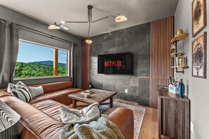 Smart TV, fireplace, foosball, books