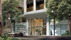 A modern multi-story building with a unique architectural design, featuring arched balconies and large windows. - Hotel Tres Altares Sabaneta (Sabaneta)