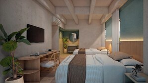 A modern hotel room with a large bed, a desk, and a seating area. - Hotel Tres Altares Sabaneta (Sabaneta)