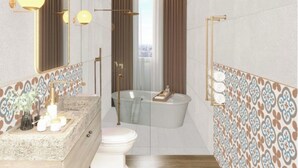 A modern bathroom with a freestanding bathtub, a vanity with a marble countertop, and a large mirror. - La Santa Hotel Boutique (Santa Marta)