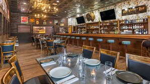 A bar with a wooden counter and a sign that reads 'Old Whiskey Bar.' - Contemporary luxury in the heart of Silverthorne (Silverthorne)