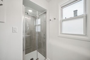 Shower, hair dryer, towels, soap