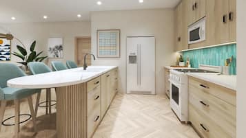 Sapphire Sands Three Bedroom Suite Beach Front | Cocina privada | Refrigerador con congelador, microondas, horno y parrilla de estufa