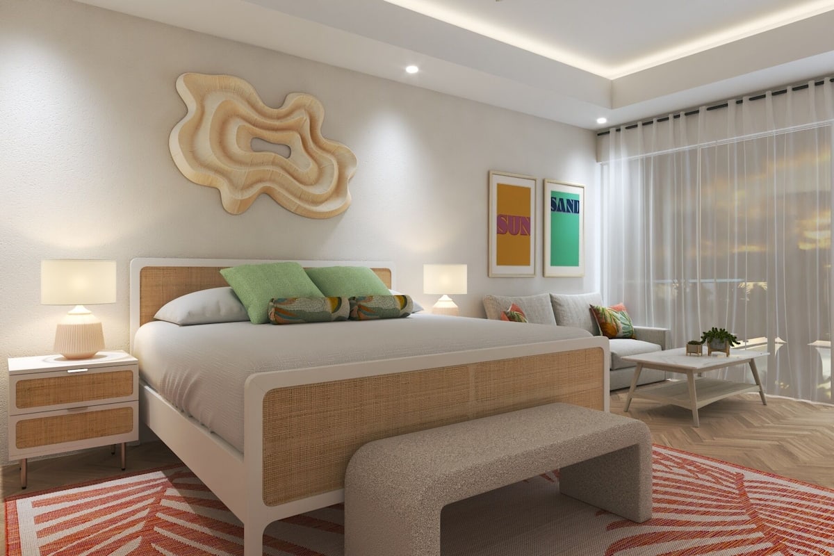 A modern bedroom with a large bed, bedside tables, a bench, and a view of the outdoors.