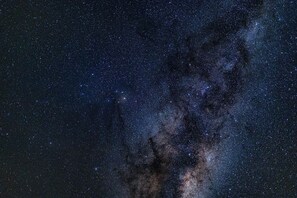 A starry night sky with a dense cluster of stars and a visible galaxy. - Mangamaunu Cottage, The Mangamaunu Cottage (Hapuku)