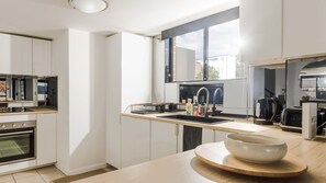 Fridge, microwave, oven, stovetop - KozyGuru | Homebush West | Modern 2R Apt + Parking (Homebush West)