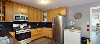 Charming bungalow steps to beach, fireplace, with deck & game room