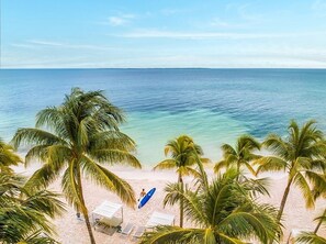 On the beach, sun-loungers, beach towels