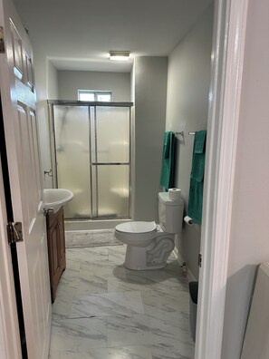 Shower, towels, soap, toilet paper