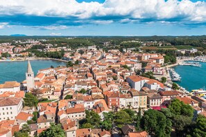 A coastal town with historic buildings, a prominent church tower, and a marina. - Villa Aria with heated Pool and Whirlpool, Poreč, Croatia (Poreč)