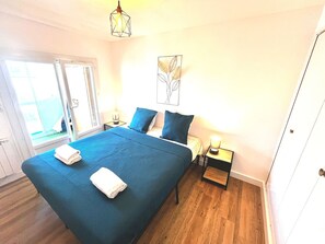 1 bedroom, desk, iron/ironing board, travel crib