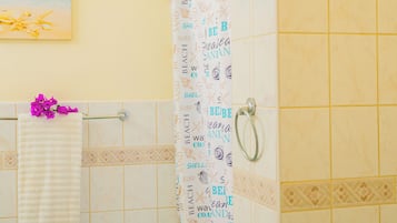 Shower, hair dryer, towels, toilet paper