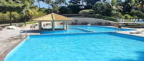 Indoor pool, 5 outdoor pools, open 6:00 AM to 10:00 PM, pool umbrellas