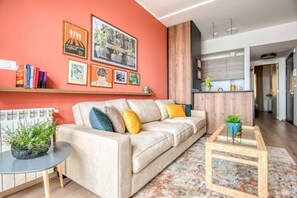 Daisy - Mountain view 1BR Apartment & Balcony | Living room | 43-inch TV with digital channels, streaming services - RedRock Faqra - Mountain Getaway Residences W Pool & Balconies (Bqaatouta)