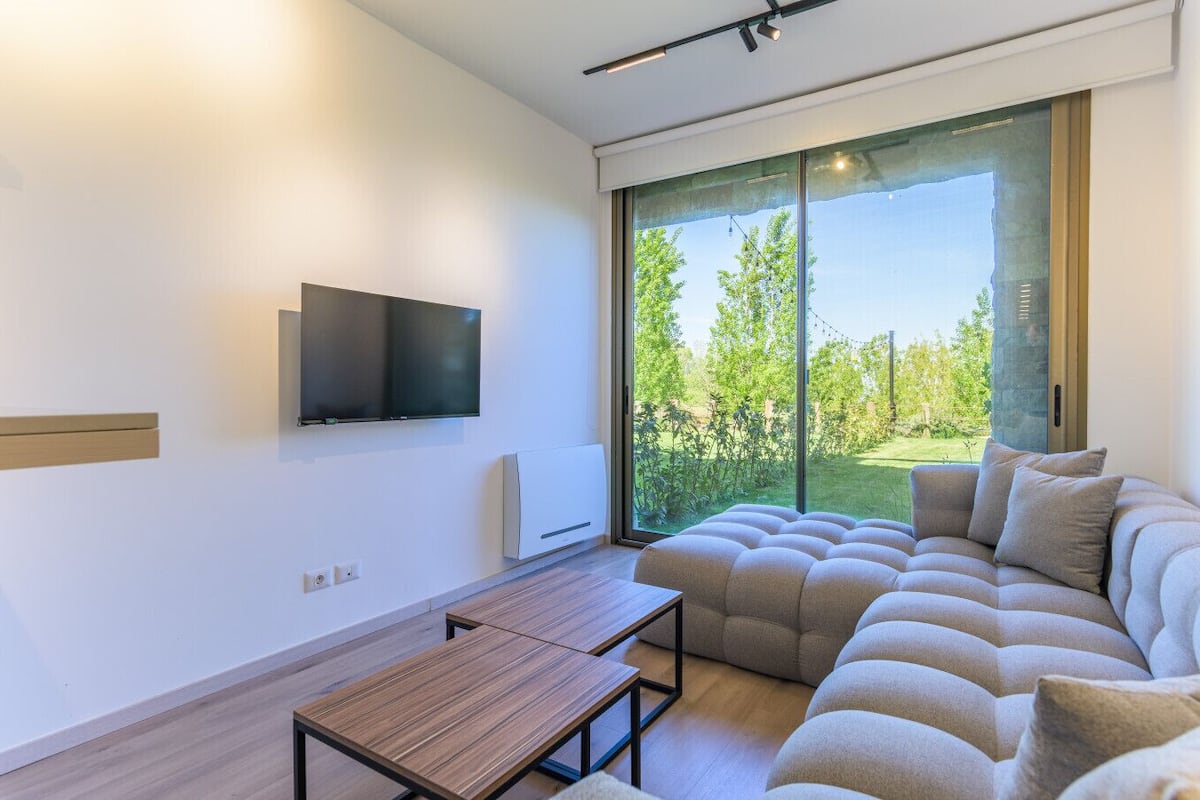 Faye - Mountain view 1BR Apartment & Garden | Living room | 43-inch TV with digital channels, streaming services