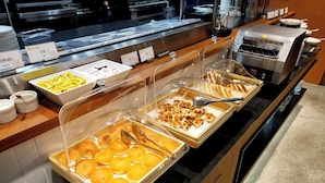 A buffet area with various food items and condiments. - 88Hotel (Seoul)