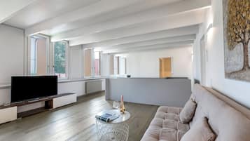 Standard Apartment, 3 Bedrooms, 2 Bathrooms (Deluxe Duplex Lugano) | Living room | 21-inch flat-screen TV with satellite channels