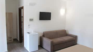 Habitación cuádruple Confort, patio, vistas al jardín | Caja fuerte, cortinas opacas, wifi gratis