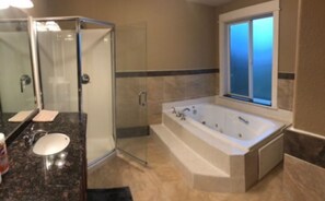 Shower, jetted tub, hair dryer, towels