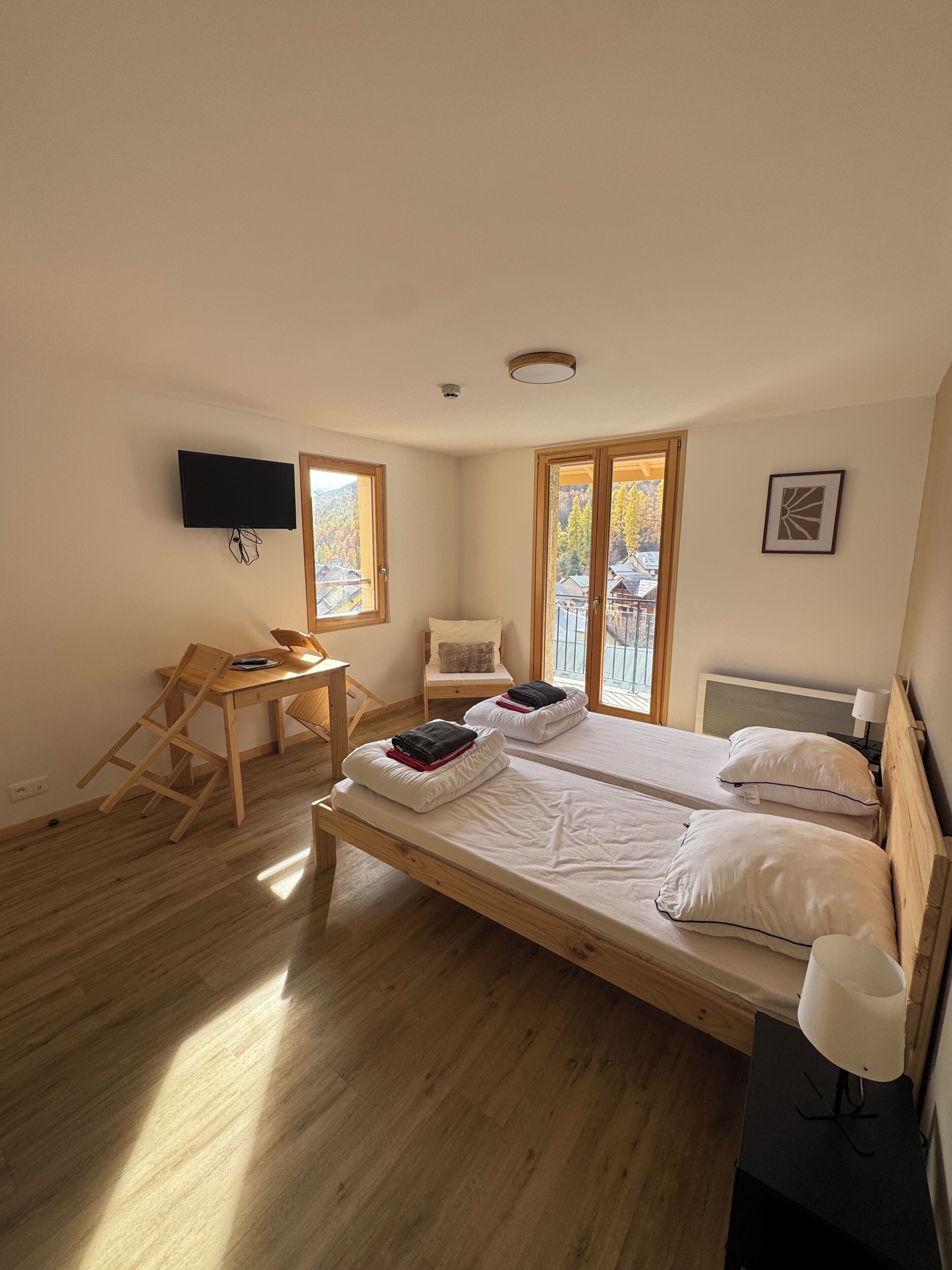 Standard Double Room, City View | Living area | TV