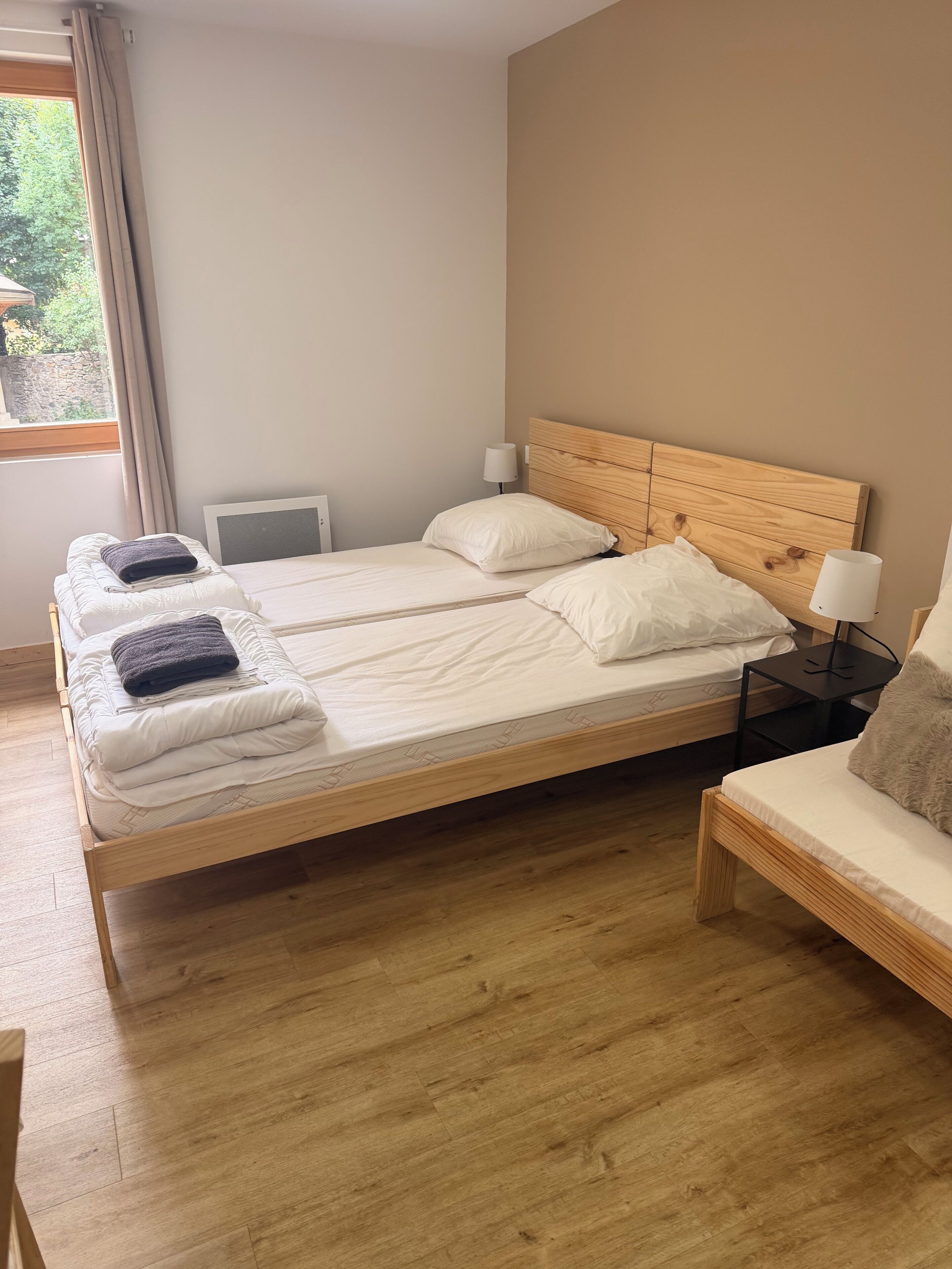 Classic Triple Room, City View | Living area | TV