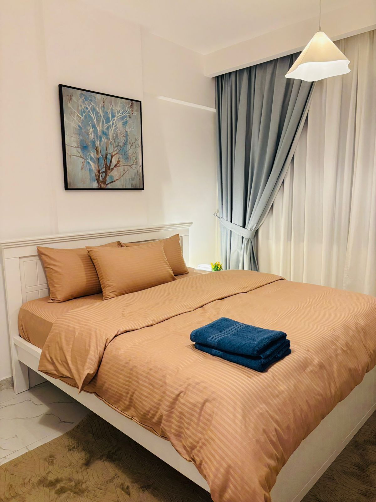 Premium bedding, desk, laptop workspace, soundproofing