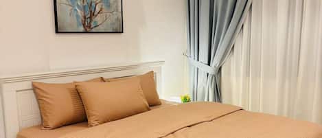 Premium bedding, desk, laptop workspace, soundproofing