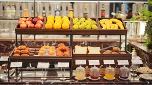 A breakfast buffet with various fruits, pastries, and condiments. - Haig Court (Shanghai)