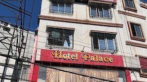 A multi-story building with a prominent 'Hotel Palace' sign on the facade. - Hotel Palace- Near Ruby Hospital (Kolkata)