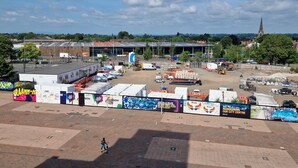An industrial area with warehouses, a large open space, and a distant church spire. - Quaint 2-bedroom apartment with WiFi in charming Wolverhampton city centre (Wolverhampton)