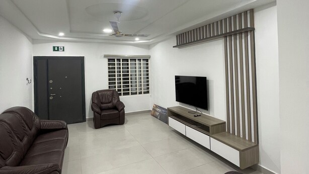 A living room with a sofa set, a television, and a ceiling fan. - Villa Fafa — Comfort in style (Ho)